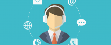 sales person with headset on surrounded by communication methods.