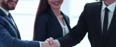 a sales team shaking hands with a customer
