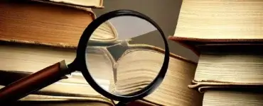 multiple books under a magnifying glass